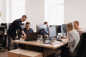 Group of young business people working in the office ArthurHidden