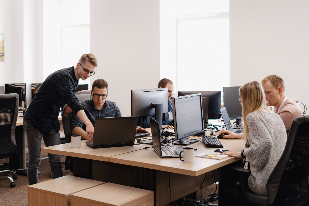 Group of young business people working in the office ArthurHidden